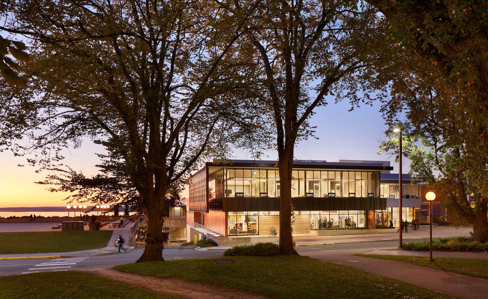 Western's Multicultural Center lit up by the sunset at dusk.