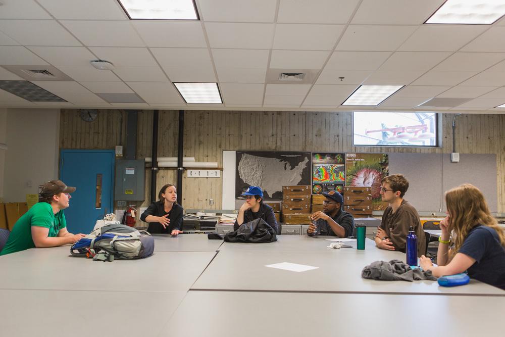 Dr. Melissa Rice and students in a geology classroom.